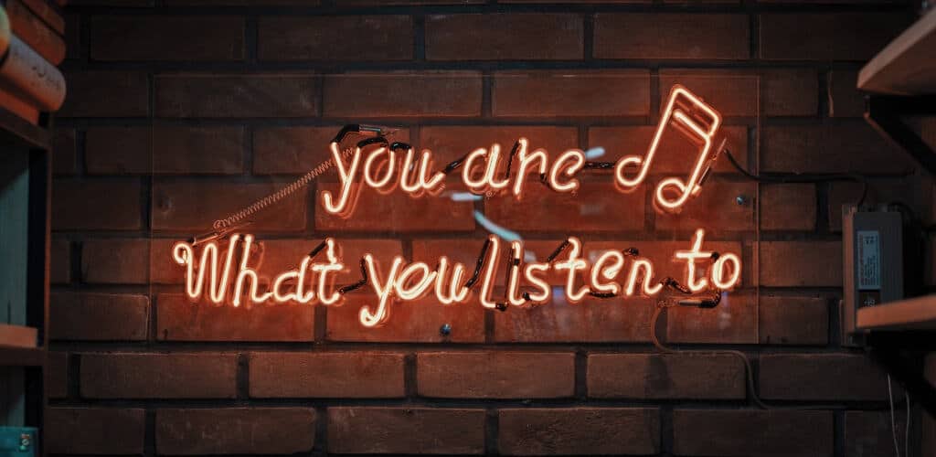 Old neon sign featuring sponsorship opportunities based on the music you listen to.