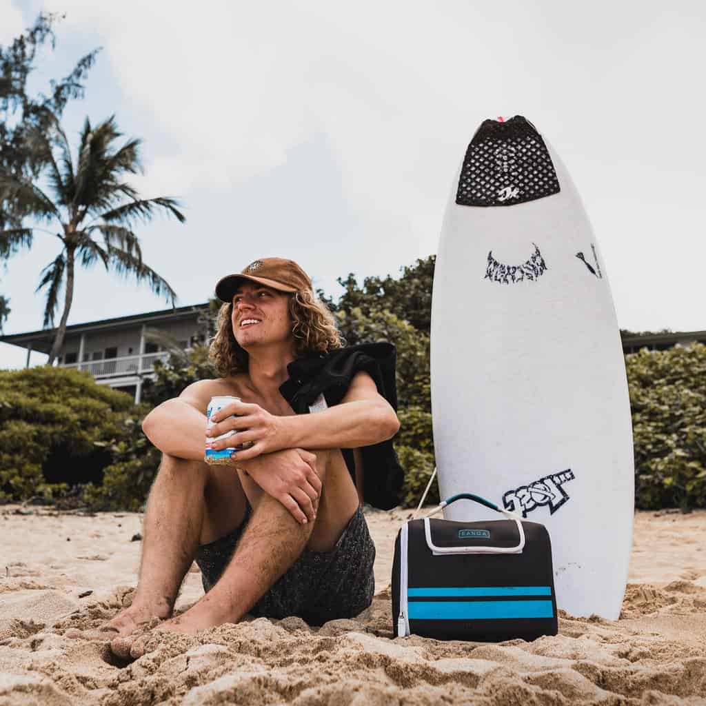 Kanga's case coolers in action at the beach, keeping drinks gold without ice.