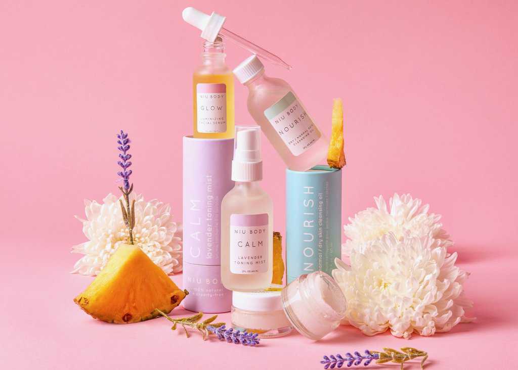 A selection of serums, lip scrubs, and toners from NIU BODY.