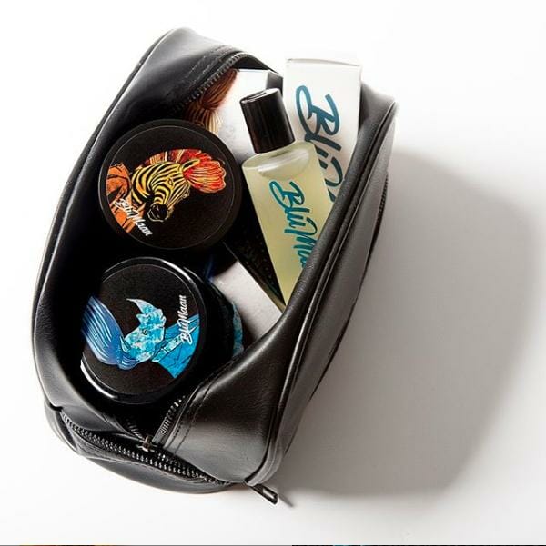 A travel bag filled with products from BluMaan.