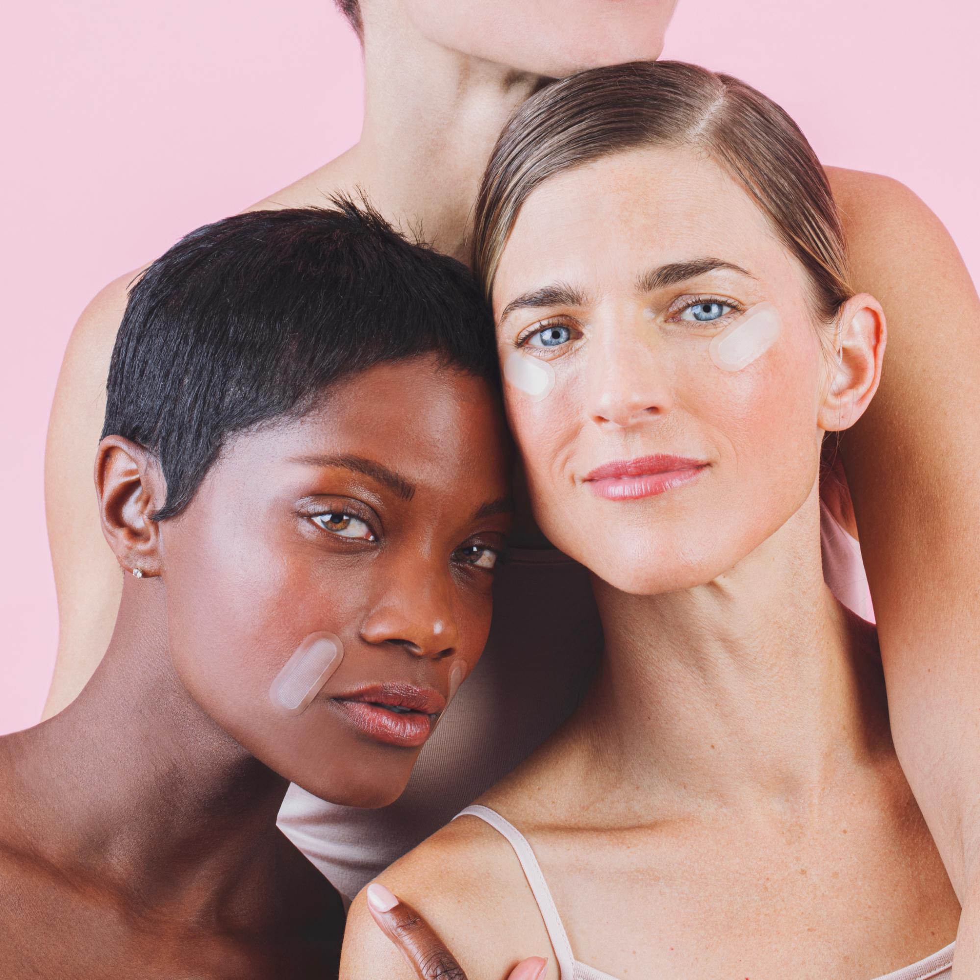 Models wearing some new retinol patches from Peace Out Skincare.