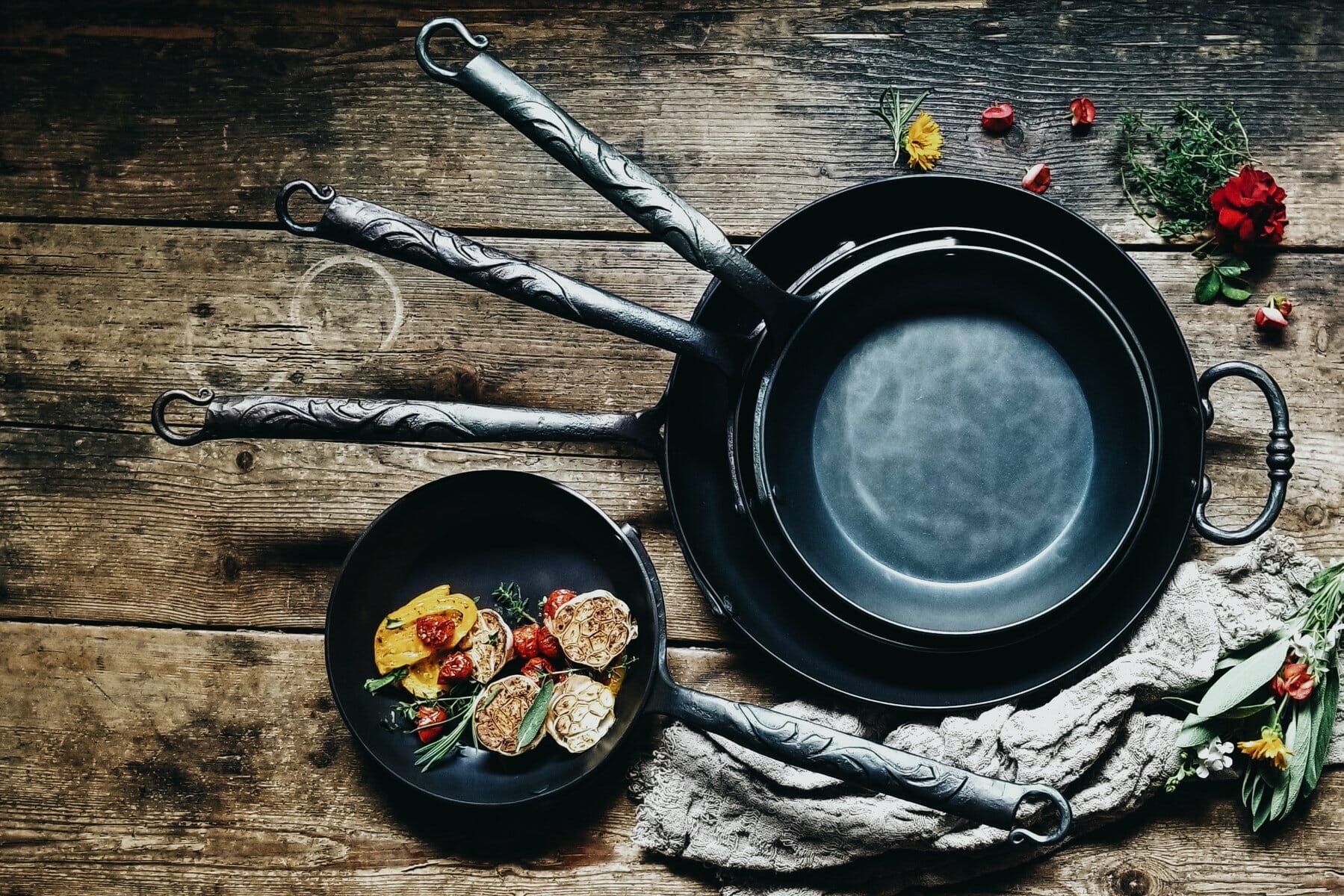 Cast pans on a wooden surface