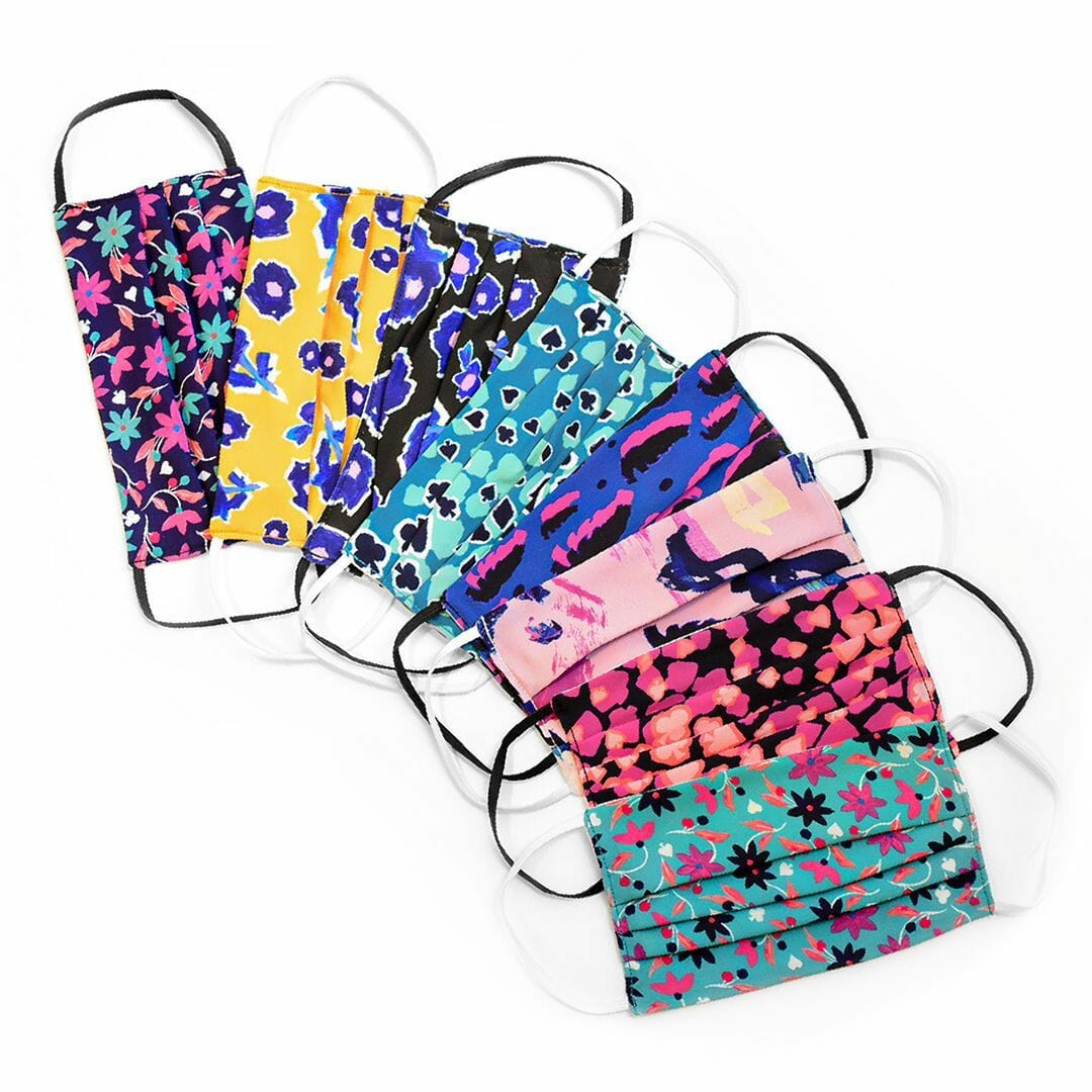 A stack of colorful printed face masks