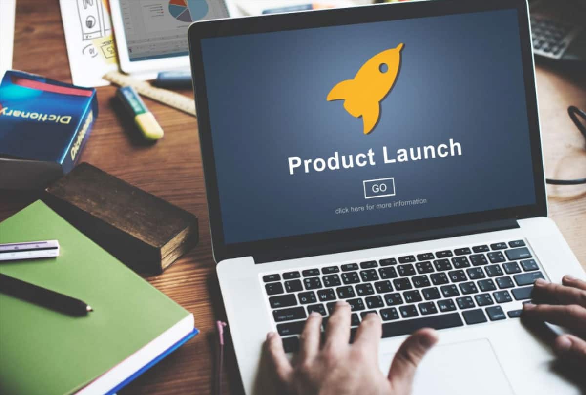 A person using a laptop for marketing a DTC ecommerce product launch.