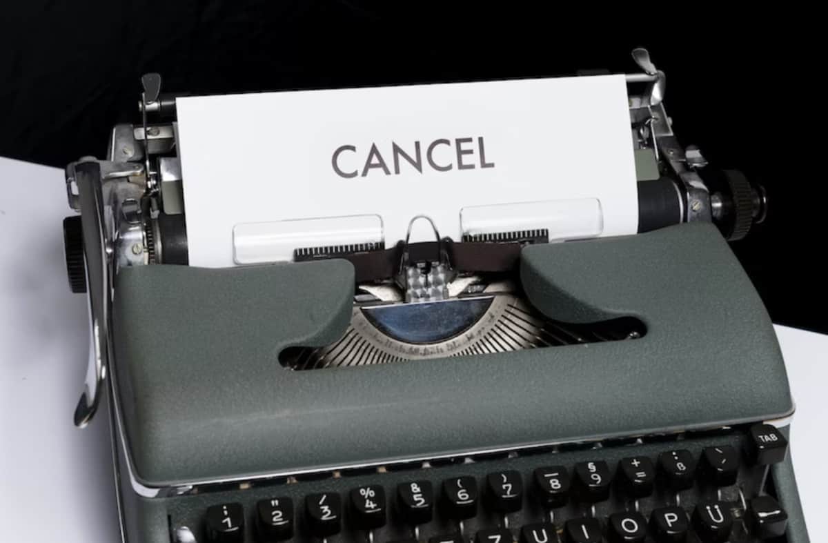 A typewriter with the word "cancel" prominently displayed.