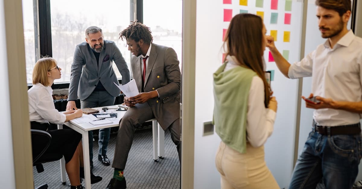A group of professional business people in an office.