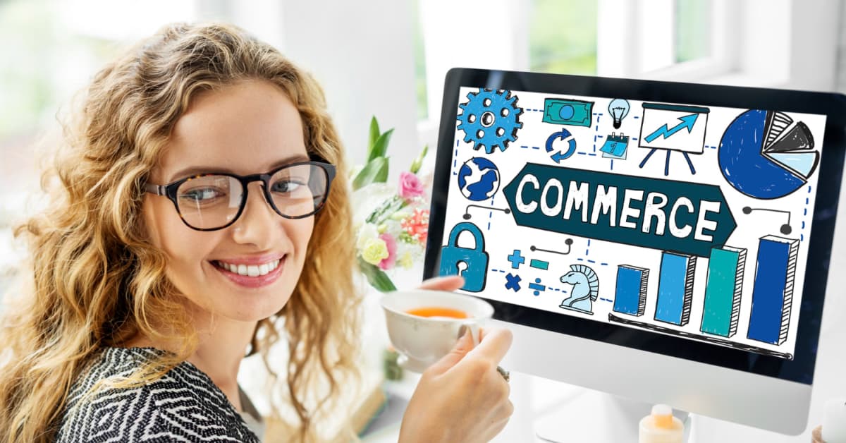 Woman with glasses eating soup while looking at a computer screen displaying icons related to e-commerce marketing.