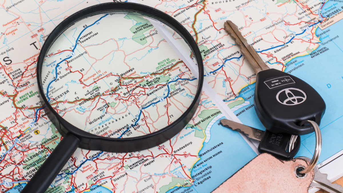 A magnifying glass and car keys rest on a map highlighting North East USA, including Massachusetts, Rhode Island, and parts of surrounding states—an ideal visual for a beginner's guide to geofencing and location-based marketing.