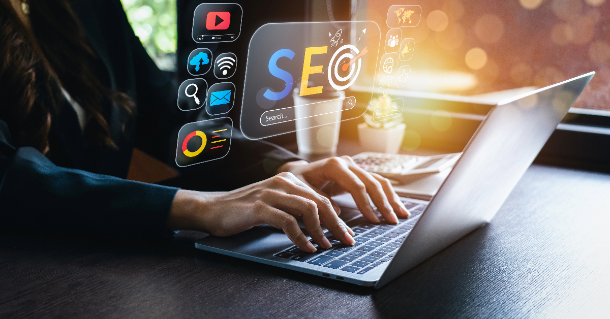 A person typing on a laptop with SEO (Search Engine Optimization) icons and digital marketing graphics overlayed on the image, showcasing ways to help handle increases in store traffic.