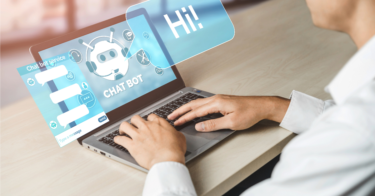 A person types on a laptop displaying a chatbot interface with the bot saying "Hi!" on the screen, showcasing the chatbot revolution in customer engagement.
