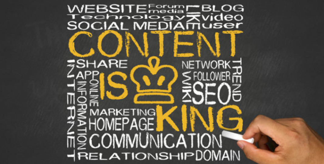 Hand writing on a chalkboard filled with words related to digital media and marketing. The central phrase is "Content is King," with a crown symbol replacing the letter "i" in "King." Emphasizing quality content, the board also highlights strategies from top eCommerce websites.