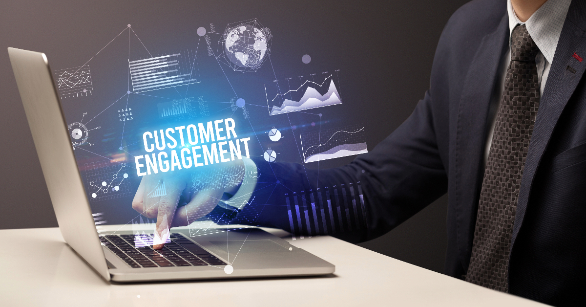 A person in business attire uses a laptop with graphics and the text "Enhance eCommerce Engagement" overlaying the image.