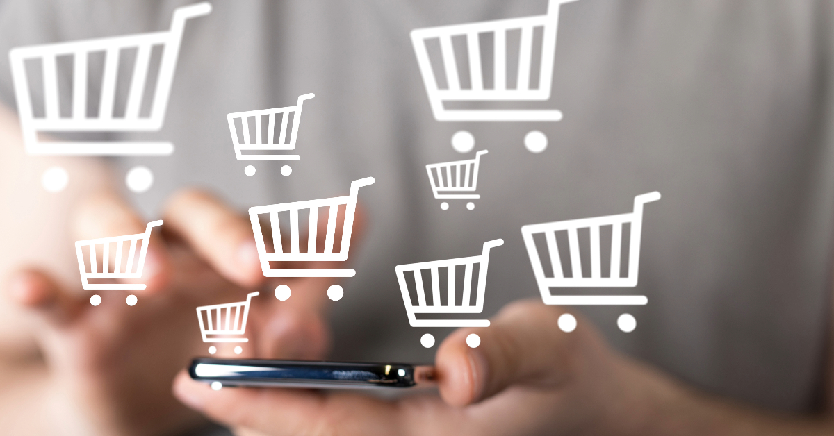 Close-up of a person using a smartphone with virtual shopping cart icons floating above the screen, representing online shopping and ephemeral sales events.