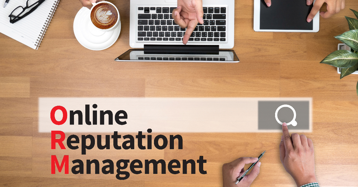 Top view of a table with a laptop, tablet, coffee cup, notepad, pen, and a search bar graphic. Text on the image reads "Online Reputation Management" with the initials "ORM" highlighted in red. Perfect for eCommerce businesses looking to streamline their reputation management efforts.