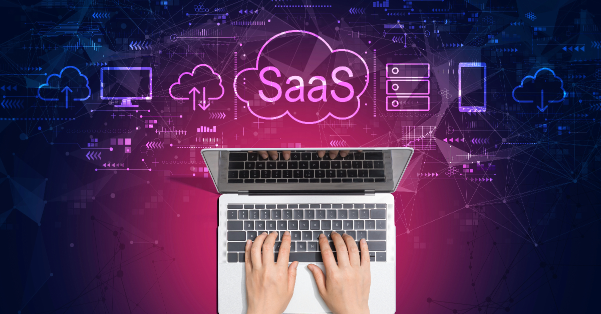 Hands typing on a laptop keyboard with a SaaS (Software as a Service) concept illustration featuring cloud icons and digital imagery in the background, emphasizing user retention strategies.