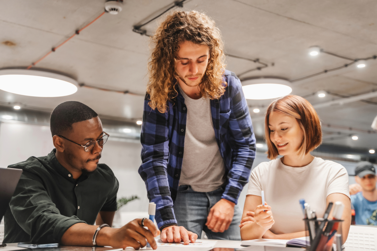A group of people implementing a growth marketing strategy in an office.