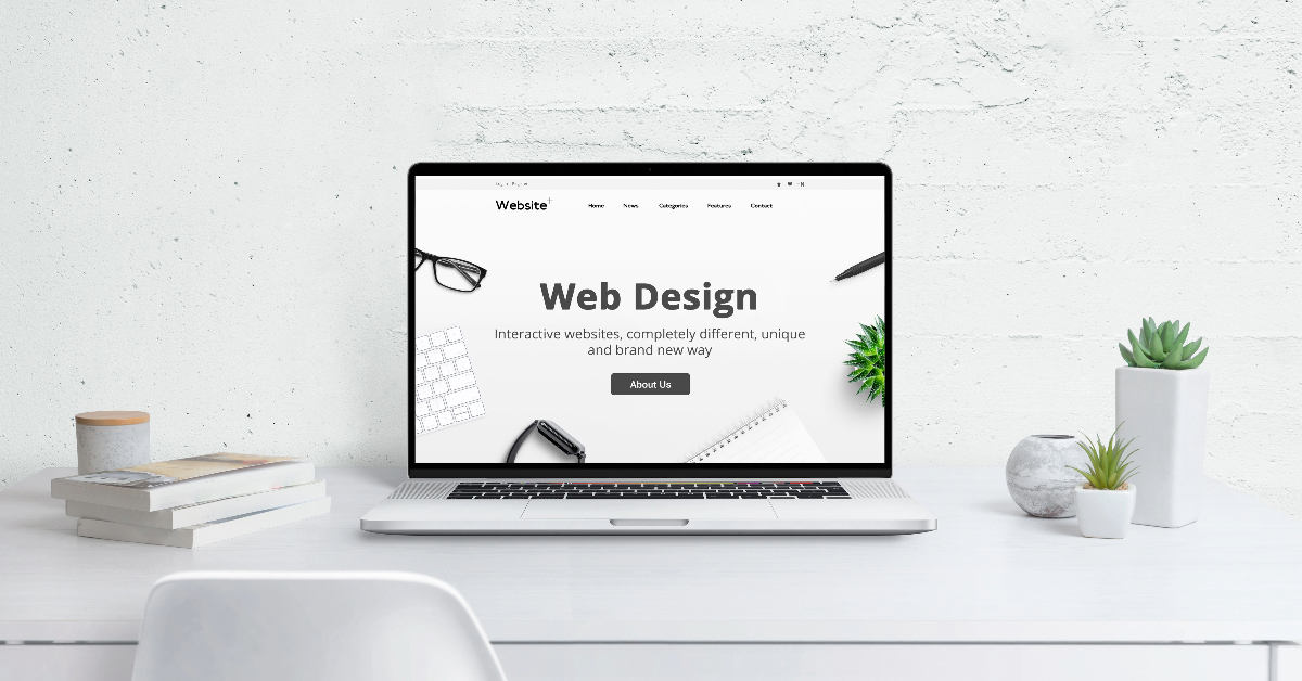 A laptop is displaying a web design website on a desk, showcasing stunning sites created through innovative strategies.