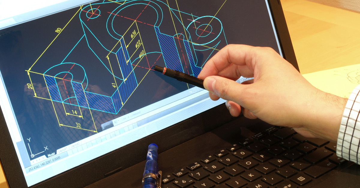 A person is pointing with a pen at a CAD drawing of a mechanical part on a laptop screen, showcasing the impressive capabilities of AutoCAD 2024 to get the product just right.