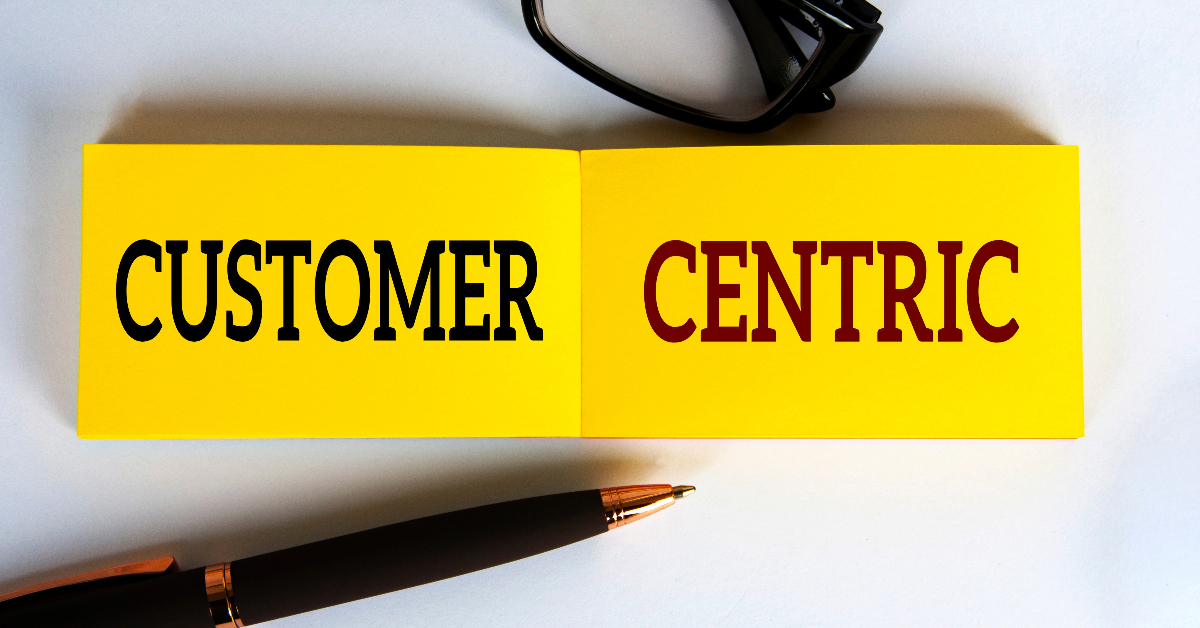 A customer-centric yellow book with the word customer central on it.
