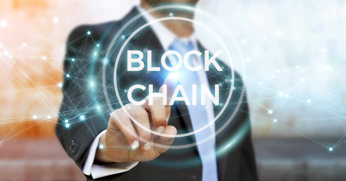 A businessman is pointing at the word Solana, a high-performance blockchain with numerous advantages.