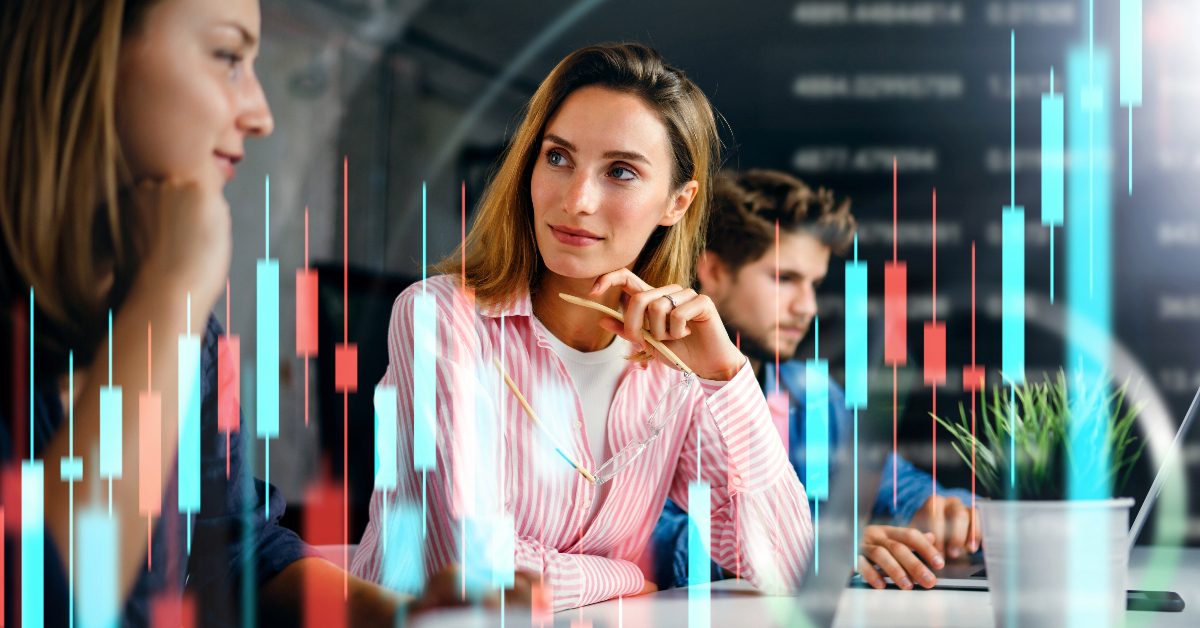 A group of people sitting at a desk analyzing stock charts with Forex and Prime Brokers in the background.