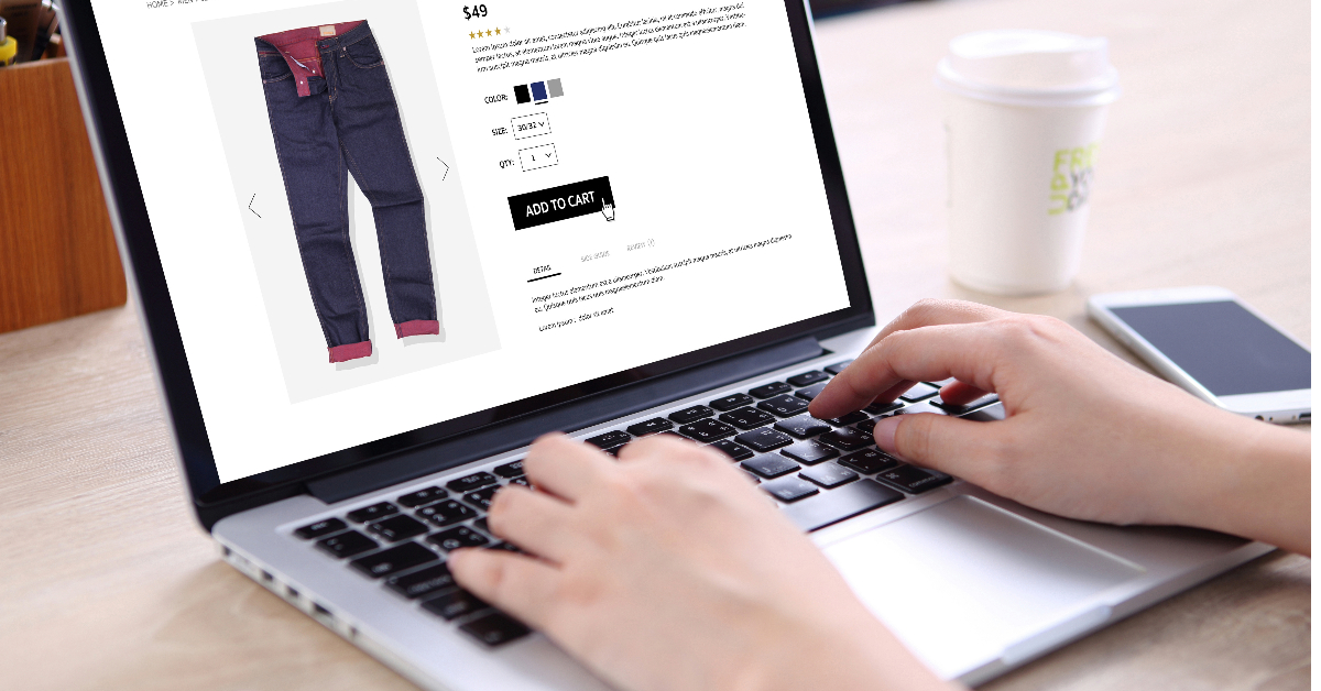 A person typing on a laptop with an ecommerce website powered by WooCommerce plugins on the screen, aiming to Boost Average Order Value.