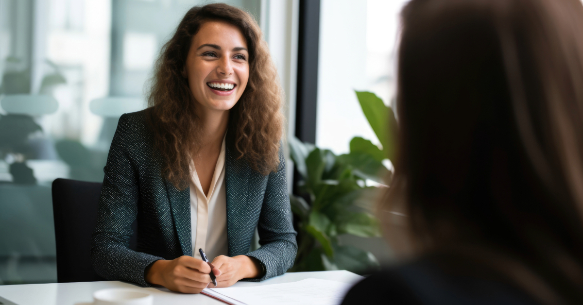 A woman in a business suit is streamlining business processes by sharing tips with a man in an office.