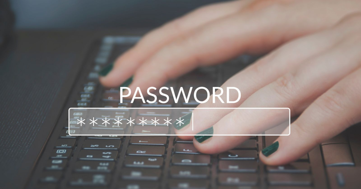 A person securing their online identity by typing on a keyboard with the word password while using a password manager.