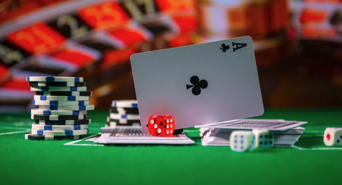 Stacks of poker chips, two dice, and a deck of cards with an ace of clubs on green felt evoke the thrill of chance. In the background, roulette wheels spin like the quick pace of a thriving Shopify ecommerce platform.