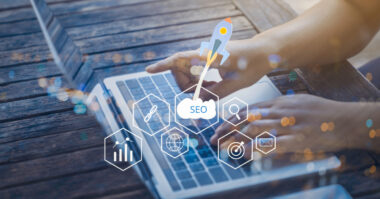 A person typing on a laptop with SEO-related icons and graphs overlayed, symbolizing the dynamic world of Shopify and ecommerce, where online search engine optimization plays a vital role in driving DTC success.