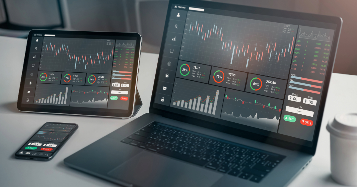 Digital trading platforms displaying Forex charts and data on a laptop, tablet, and smartphone on a desk with a coffee cup, offering a beginner's guide to navigating the market.