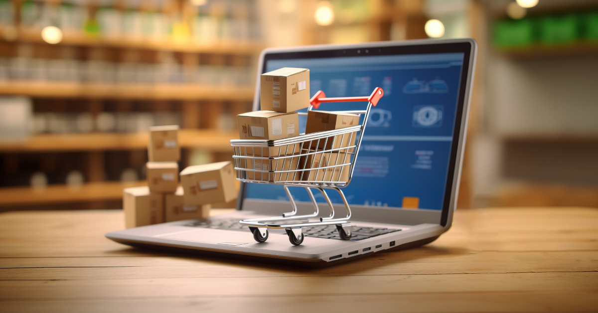 A miniature shopping cart filled with small cardboard boxes sits on a laptop keyboard, symbolizing ecommerce and the convenience of running an online shop with platforms like Shopify.