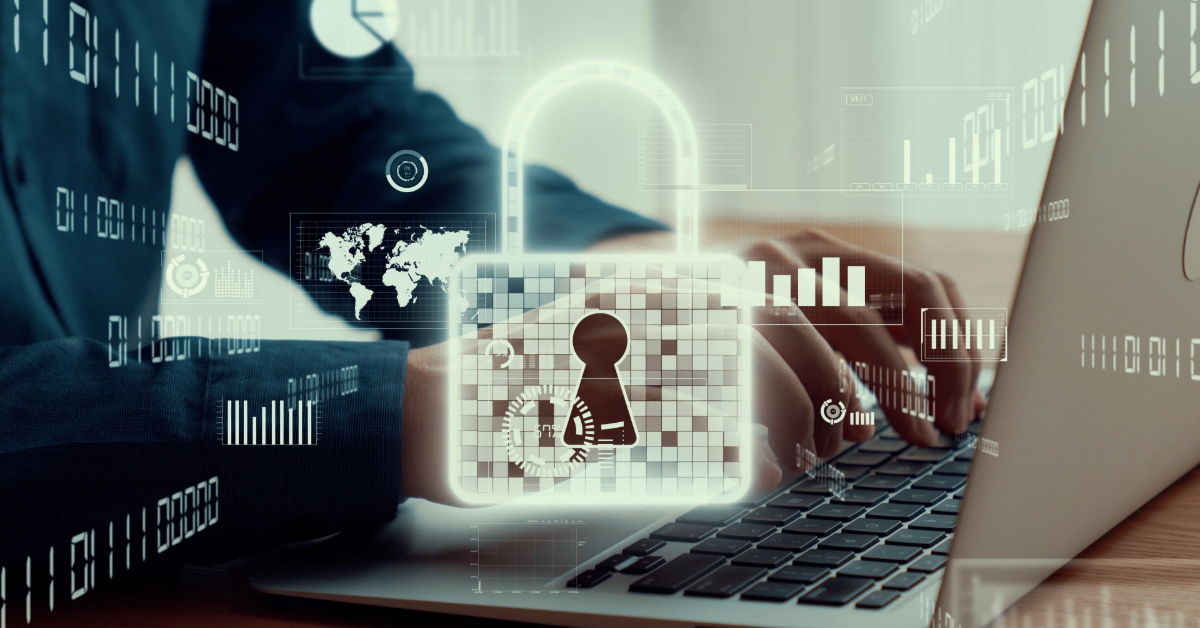Person typing on a laptop with a transparent padlock and digital security icons overlayed, representing data protection, cybersecurity concepts, and the essentials covered in CISSP training.