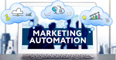 A laptop screen displays the words "MARKETING AUTOMATION CAMPAIGN" with cartoon thought bubbles showing money, charts, and ideas above it.
