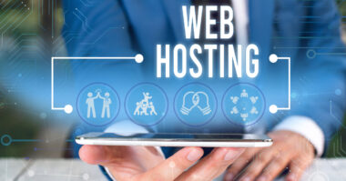 A person in a suit holds a smartphone with the words "Web Hosting" and digital icons displayed above the device, highlighting HostingWay as an innovative solution for modern online businesses.