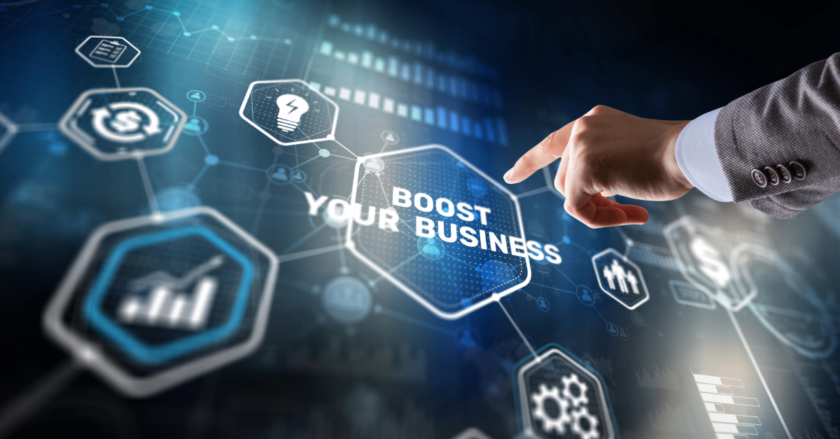 A person’s hand points to a transparent digital interface displaying the words “Boost Your Business,” surrounded by business and technology icons, emphasizing sales growth and E-commerce sales strategies for 2024.