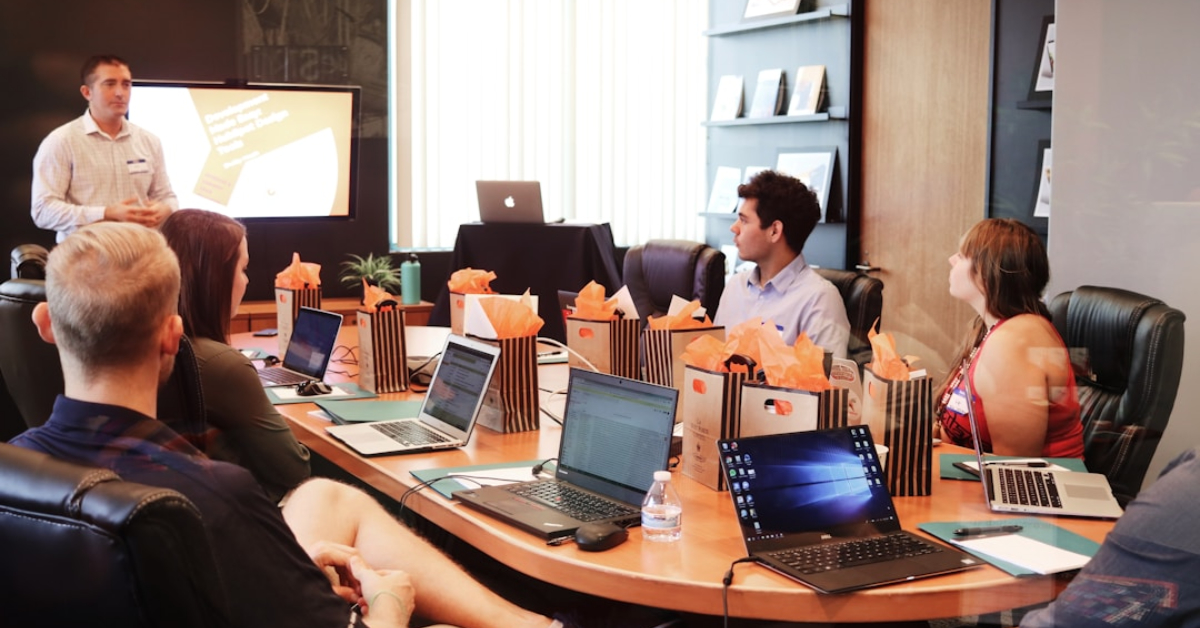 Team members in a conference room evaluating vendor support and software scalability