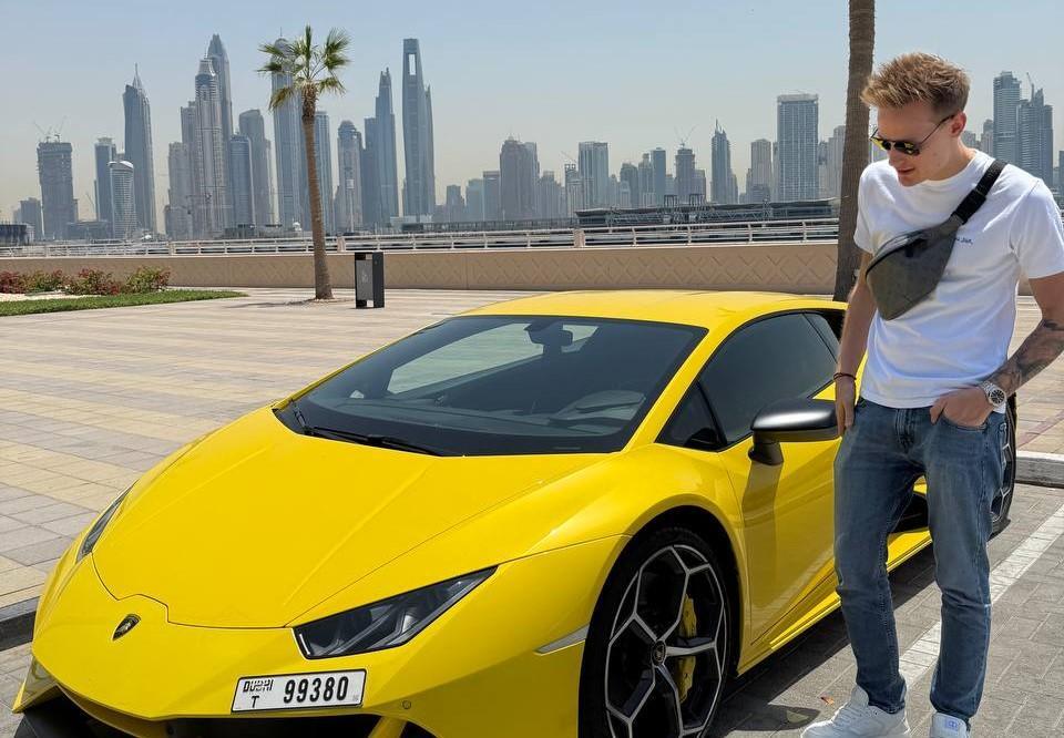Oleksandr Orlovskyi near his car in Dubai